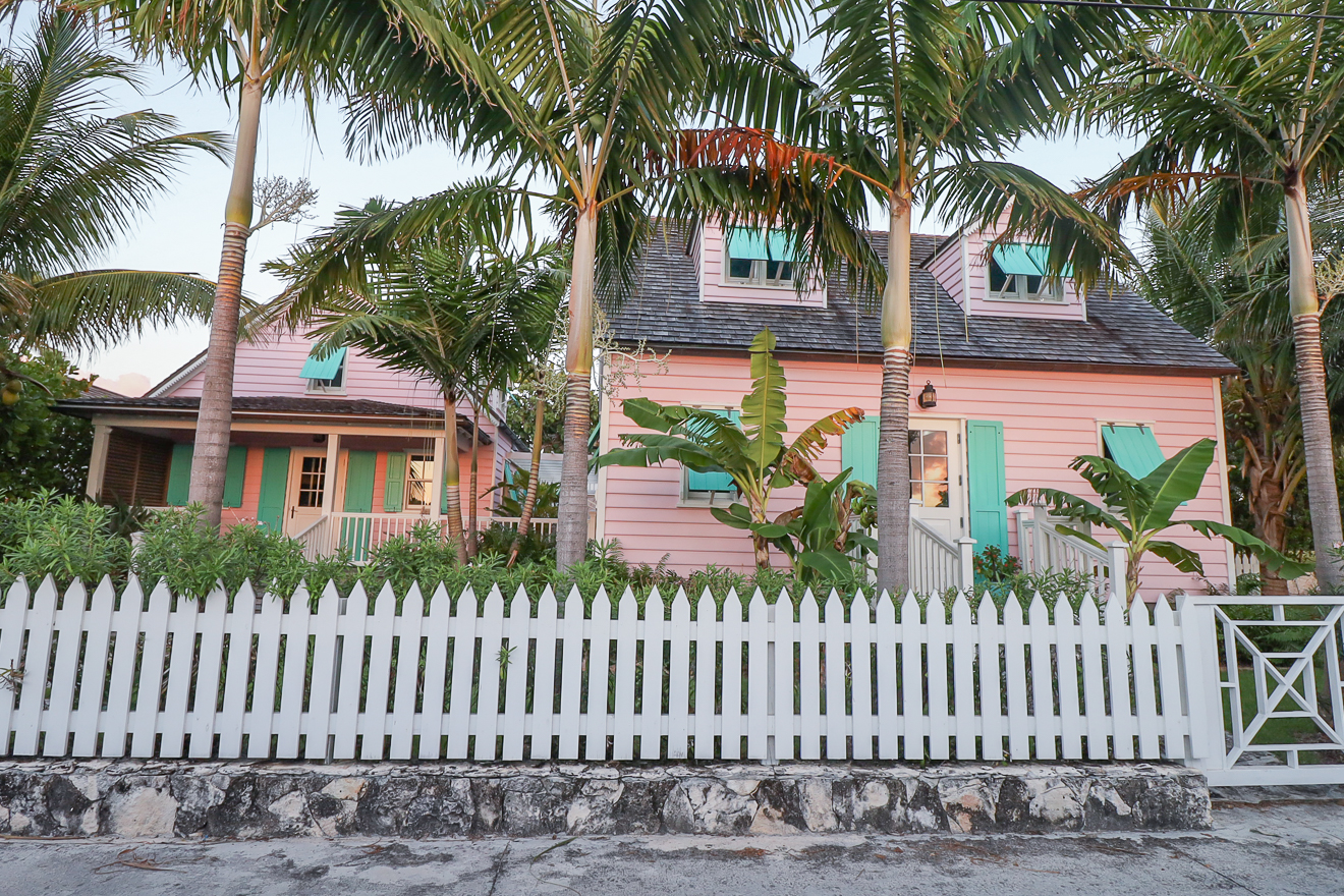 Hummingbird Cottages pink exterior with white picket fence, Hope Town Bahamas