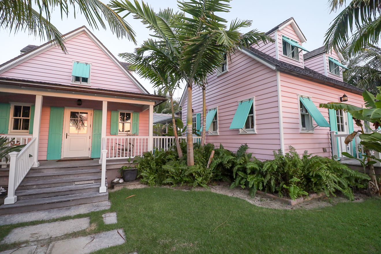 Both cottages and lush garden at twilight